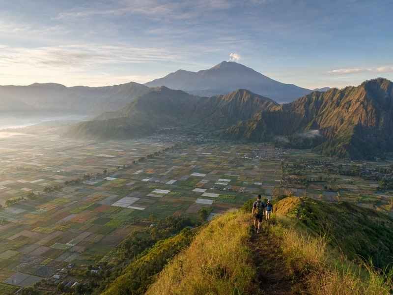 Hiking Pergasingan Hill overlooking Sembalun Valley and Mount Rinjani