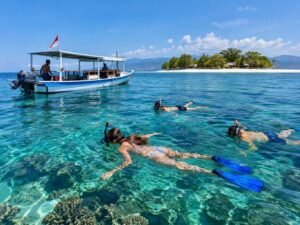 Travelers enjoying responsible snorkeling around the smaller Gili islands Lombok