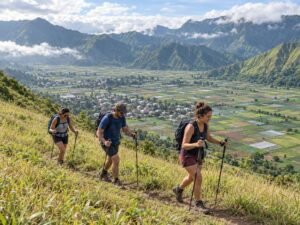 Hikers ascending the grassy slopes of Pergasingan Hill above Sembalun